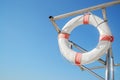 Old white life ring/lifebuoy hanging on boat supports Royalty Free Stock Photo