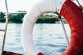 Old lifebuoy in red and white on  the yacht Royalty Free Stock Photo