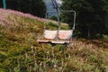 old lift hoist at top of mountains with amazing view, empty chairs chairlift, travel adventure concept