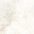 Old light brown background with stains and central torn distressed empty texture Royalty Free Stock Photo