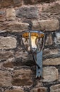 Old light hanging on the wall of a church