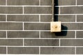 Old light switch on grey brick wall , outddor Royalty Free Stock Photo