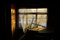 Old light window with a curtain in a dark room Royalty Free Stock Photo