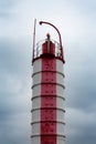 Old lighthouse on the background of a cloudy sky Royalty Free Stock Photo