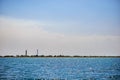 Old lighthouse on the beach near the sea. Lighthouse on the coast of the island Dzharylgach Royalty Free Stock Photo