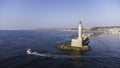 Old lighthouse building at Chania, Greece. Famous travel tourism landmark. Aerial top down drone view