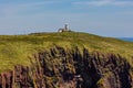 The old lighthouse built 1829 on Caldey Island off the coast of the Welsh town, Tenby Royalty Free Stock Photo