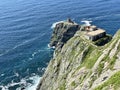 Old lighthouse on Cape Elagina on Askold Island in summer. Russia, Primorsky Krai Royalty Free Stock Photo