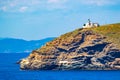 Old lighthouse at coast of the Saronic Gulf Greece