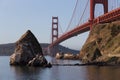 Old lighthouse and fog station under Golden Gate bridge in sunri Royalty Free Stock Photo