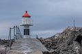 Old lighthouse in Laukvik in gray weather, Lofoten, Nordland, Norway Royalty Free Stock Photo