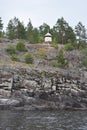 the old lighthouse stands on the cliff