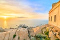 The old lighthouse at sunset on the Capo Testa peninsula, Sardinia, Italy Royalty Free Stock Photo