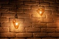 Old lighting electric bulb, Retro lamp on a background of a white brick wall Royalty Free Stock Photo