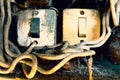 Old Lighting Switch on the wood wall. Close up hand turning on or off on grey light switch with wooden background. Copy space Royalty Free Stock Photo