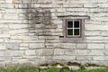 Old limestone wall with square window