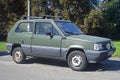 Old little green compact city veteran small car Fiat Panda I parked