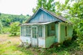 Old little house with a wooden roof. Royalty Free Stock Photo