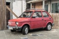 Old small classic Polish car Polski Fiat 126p parked on pavement Royalty Free Stock Photo