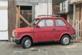 Old small classic Polish car Polski Fiat 126p parked on pavement Royalty Free Stock Photo