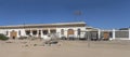 old little train and forsaken buildings at mining ghost town in desert, Kolmanskop, Namibia