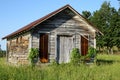 Old little wood building with rusty metal roof Royalty Free Stock Photo