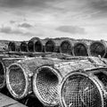 old lobster traps are stacked up in the port on a pier Royalty Free Stock Photo