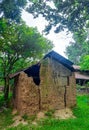 Old local traditional house, made of soil. Concept of poverty, primitive homes, poor simple settlements in villages. Royalty Free Stock Photo