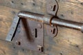 Old lock with big deadbolt to close the door of the castle Royalty Free Stock Photo