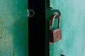 Old lock hanging on an old garage door Royalty Free Stock Photo