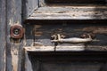 An old lock holds ancient door handles Royalty Free Stock Photo
