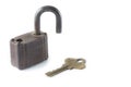 Old lock and key on white background with copyspace. Royalty Free Stock Photo