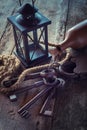 Old lock with keys, vintage lamp, bottle from clay and rope