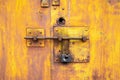 Old lock of the metal door. Rusty old metal texture with remnants of the paint. Royalty Free Stock Photo