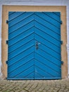 old lock wooden door is blue with a metal handle Royalty Free Stock Photo