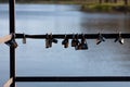 Old locks hang from the railings of the pier. Royalty Free Stock Photo