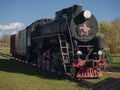 Old locomotive at station platform