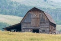 Old log barn in mountains Royalty Free Stock Photo