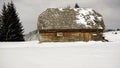 Old wooden barn in a winter landscape