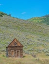 Old log cabin, abandoned in the country hillside of Rocky Mountains in Colorado Royalty Free Stock Photo