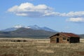 Old log cabin and mountain Royalty Free Stock Photo