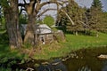 Old Log Cabin by Water's Edge Royalty Free Stock Photo