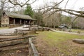 Old log house with split rail fence. Royalty Free Stock Photo