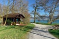 Old log house in Villette-park on the shore of lake Zug in spring. Town of Cham, canton of Zug, Switzerland.