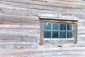 Old log house window with rustic frame Royalty Free Stock Photo