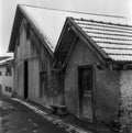 Old log huts for animal shelters in the Swiss village of Alvaneu, shot with analogue photography technique