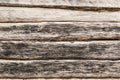 Old log wall, texture of antique wooden logs, close up decor abstraction background Royalty Free Stock Photo