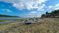 Old lonely fishing boat on the coastline Royalty Free Stock Photo