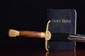 The Holy Bible with Ancient Sword Royalty Free Stock Photo