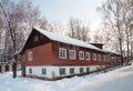 Old long wooden house, winter time Royalty Free Stock Photo